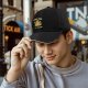 Black baseball cap with pizza tree graphic and funny food text