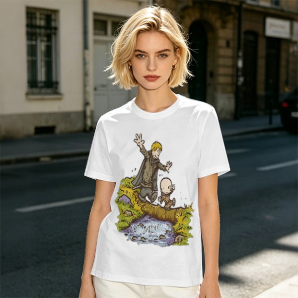Olive T-shirt with fantasy characters balancing on a log over a stream