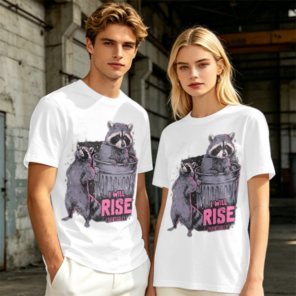 Olive graphic t-shirt with raccoons and 'I Will Rise Eventually' text