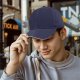 Black baseball cap with white trim on the brim
