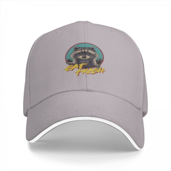 Black baseball cap with raccoon graphic and 'Eat Trash' text