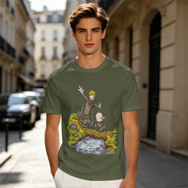 Olive T-shirt with fantasy characters balancing on a log over a stream