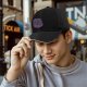 Black Baseball Cap With Purple Abstract Swirl Graphic Design