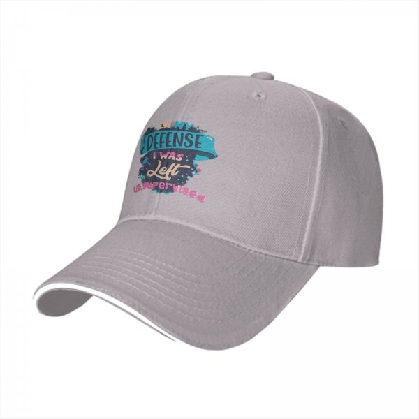Black baseball cap with 'In My Defense I Was Left Unsupervised' print