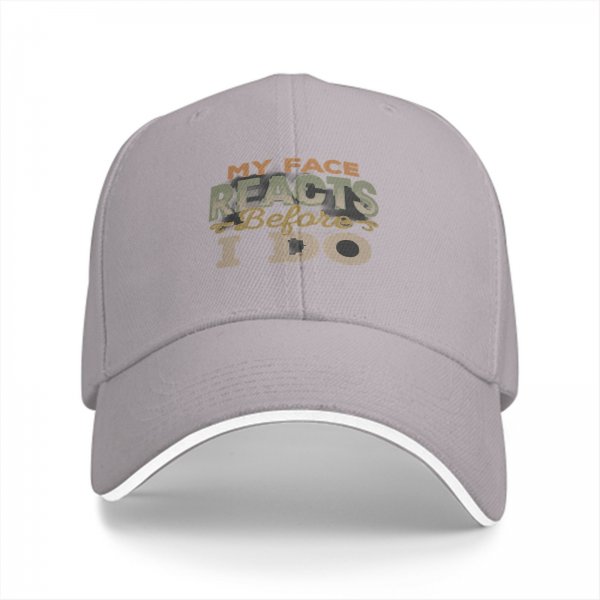 Black baseball cap with 'My Face Reacts Before I Do' printed design