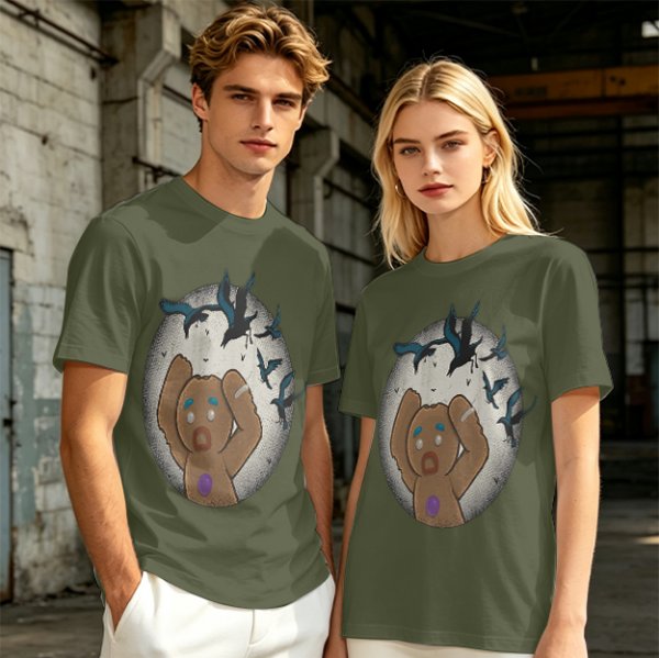 Olive T-shirt with a terrified gingerbread man and flying birds graphic