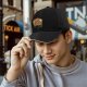 Black baseball cap with cute capybara graphic and playful text