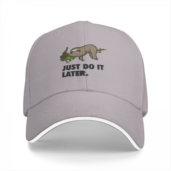 Black baseball cap with sloth graphic and 'Just Do It Later' text