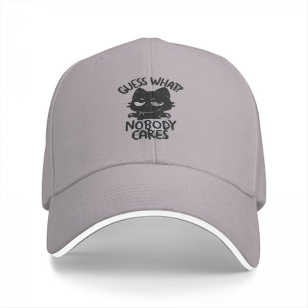 Black baseball cap with 'Guess What Nobody Cares' cat graphic