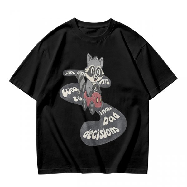 Olive graphic tee with raccoon driving car and 'Way to make bad decisions' text