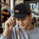 Black baseball cap with cute red panda using retro computer graphic