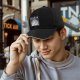 Black baseball cap with Totoro forest spirit graphic and Japanese text