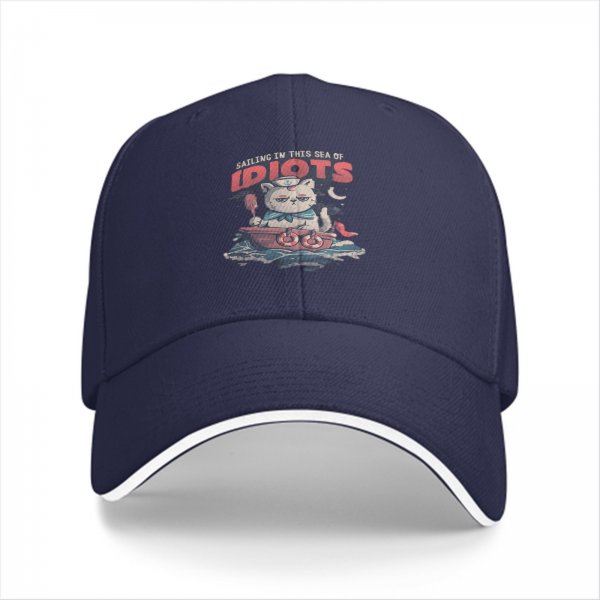 Black baseball cap with sailing cat graphic and 'Sailing in this sea of idiots' text