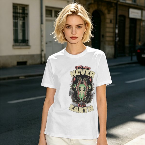 Olive green graphic t-shirt with 'cats were never from earth' alien and cat print