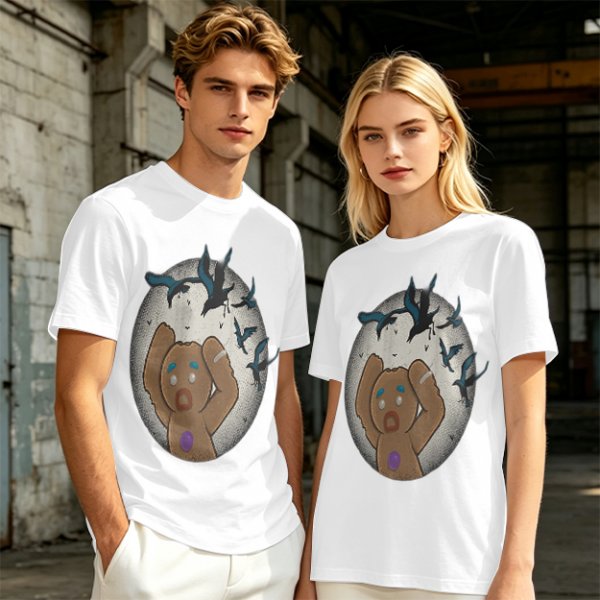 Olive T-shirt with a terrified gingerbread man and flying birds graphic