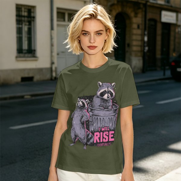 Olive graphic t-shirt with raccoons and 'I Will Rise Eventually' text