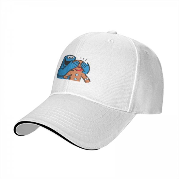 Black baseball cap with Cookie Monster covering a gingerbread man’s eyes