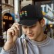 Black baseball cap with colorful emotional octopus graphic print