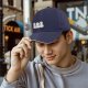 Black baseball cap with three stylized hamster graphic print