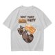 Oversized olive t-shirt with raccoon drinking beer graphic
