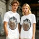 Olive T-shirt with a terrified gingerbread man and flying birds graphic
