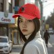 Black baseball cap with spooky pumpkin figure and 'Always Sexy' text