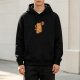 Black hoodie with cute capybara holding orange fruit graphic