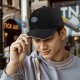 Black Baseball Cap With Circular Graphic Emblem