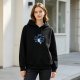 Black hoodie with narwhal graphic and playful text design