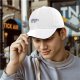 Black baseball cap with embroidered sloth holding a branch