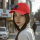 Black baseball cap with 'Here Lies My Motivation' tombstone graphic