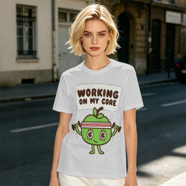 Olive green t-shirt with cartoon apple lifting dumbbells and 'Working on my core' text