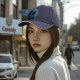 Black Baseball Cap With Playful Black Cat On Blue Abstract Background